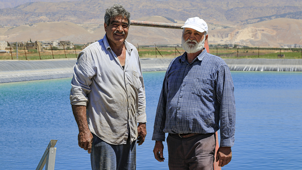 Farmers in front of the artificial lake they built to collect water - Ablah_Zahle