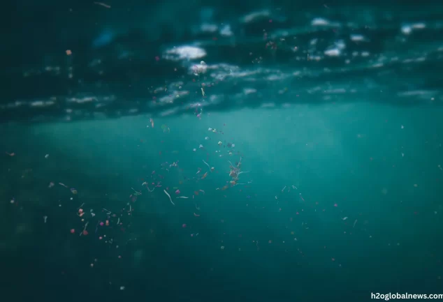 Microplastics suspended in drinking water — microscopic plastic particles invisible to the naked eye