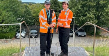 Sisters Harriet and Daisy Pearce-Lyons, leak inspectors at Bristol Water, pictured in high-visibility uniforms with detection equipment.