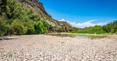 Cracked, dry riverbed illustrating severe drought and water scarcity across the United States