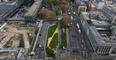Aerial view looking east along Euston Road with the station on the left; works areas and pedestrian routes visible.