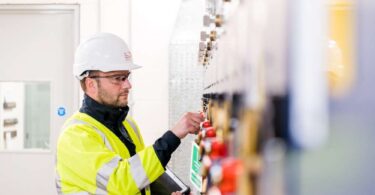 Engineer carrying out electrical maintenance to support reliable power supply for water services.