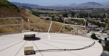A water storage tank serving the Edna Road System in California, overlooking surrounding communities supplied by Golden State Water Company.