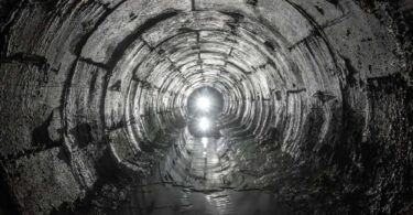 Inside a large wastewater sewer tunnel, symbolising new infrastructure upgrades in Exmouth.