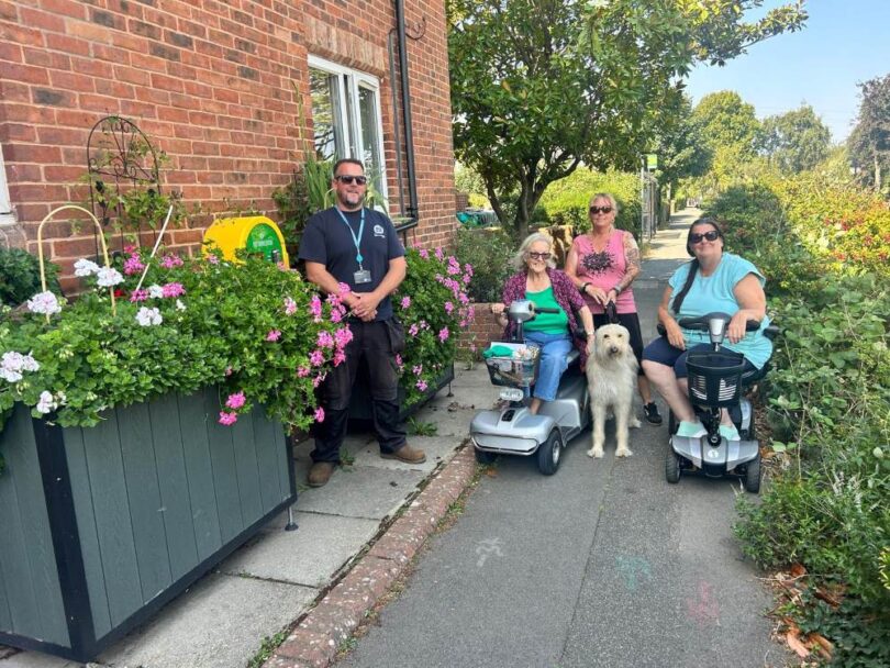 Residents and partners at Bucklers View with sustainable drainage planters installed by Sudsplanter and Southern Water