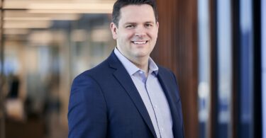 Andrew Markwick, newly appointed Chief Financial Officer of RSK Group, standing in a professional office environment.