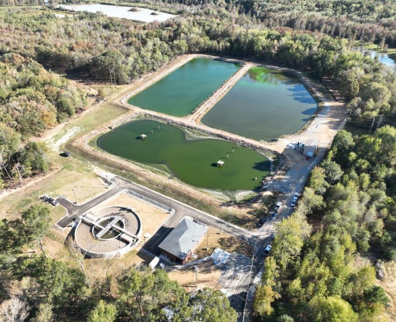 Aerial view of the Gravel Ridge facility showing the new mechanical treatment plant alongside the original wastewater lagoons used for equalisation and wet-weather flow storage.