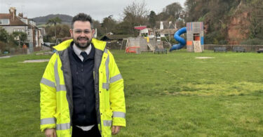 South West Water project manager standing at The Ham in Sidmouth where construction is beginning on a new storm storage tank.
