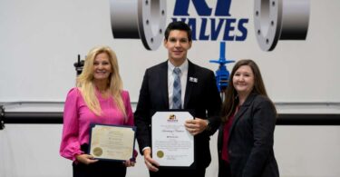 RF Valves representatives and officials holding certificates during a ribbon-cutting ceremony at the company’s Hanover facility.