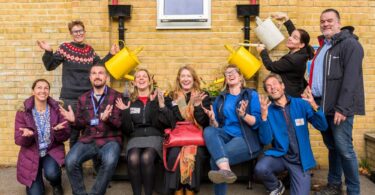 Pupils, staff and partners celebrating new SuDS planters at New Hinksey CE Primary School, Oxford