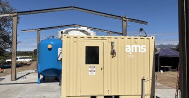 Containerised advanced water treatment system for on-site contaminant removal