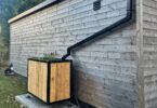 Sustainable drainage planter connected to building roof downpipe in Edinburgh SuDS pilot