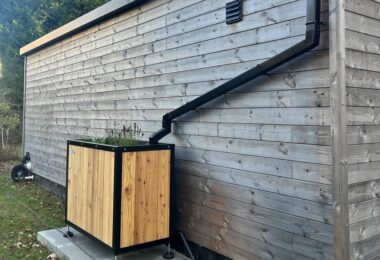 Sustainable drainage planter connected to building roof downpipe in Edinburgh SuDS pilot