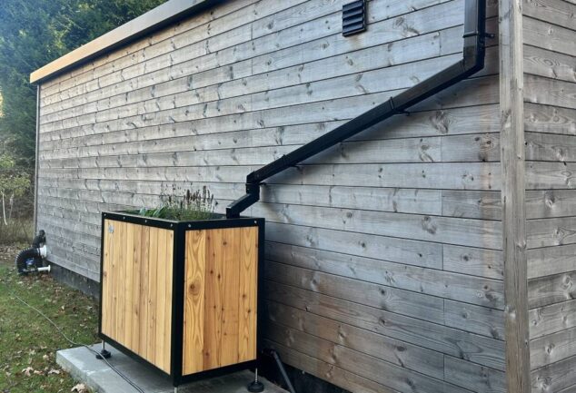 Sustainable drainage planter connected to building roof downpipe in Edinburgh SuDS pilot