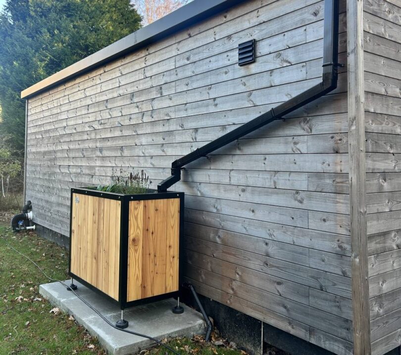 Sustainable drainage planter connected to building roof downpipe in Edinburgh SuDS pilot