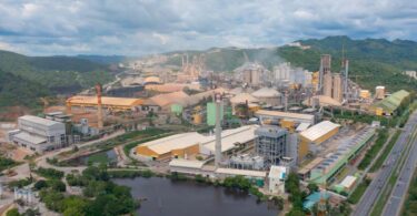 Industrial manufacturing plant with large processing facilities and water reservoirs used in industrial water management