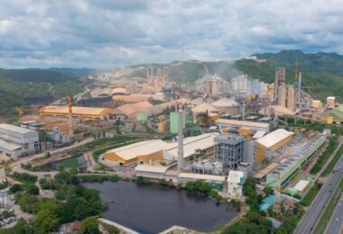 Industrial manufacturing plant with large processing facilities and water reservoirs used in industrial water management