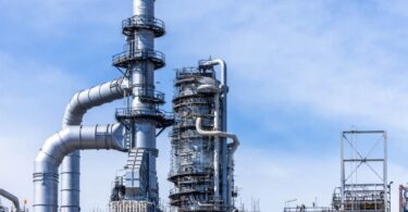 John Crane water savings LNG facility industrial plant infrastructure with pipelines and towers