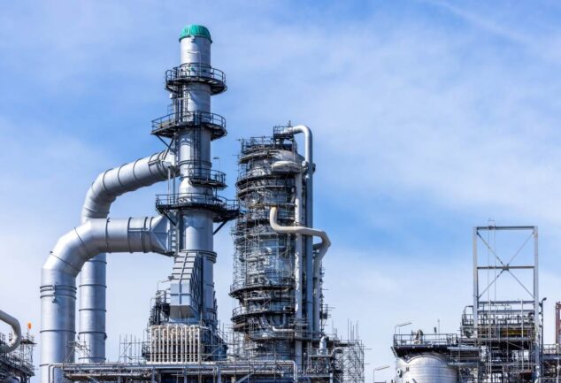 John Crane water savings LNG facility industrial plant infrastructure with pipelines and towers