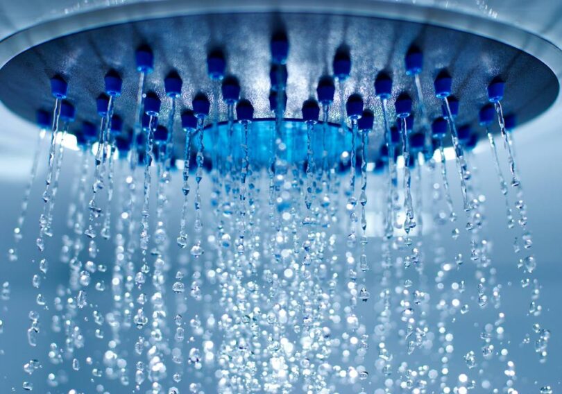 England water deficit behaviour change shower head water flow close up