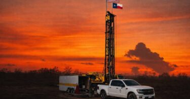 water well drilling rig operating in field supporting groundwater infrastructure development