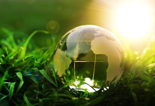 Global environmental innovation concept showing Earth in nature representing sustainability and climate action