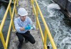 Engineer monitoring water quality at a treatment facility during operational checks