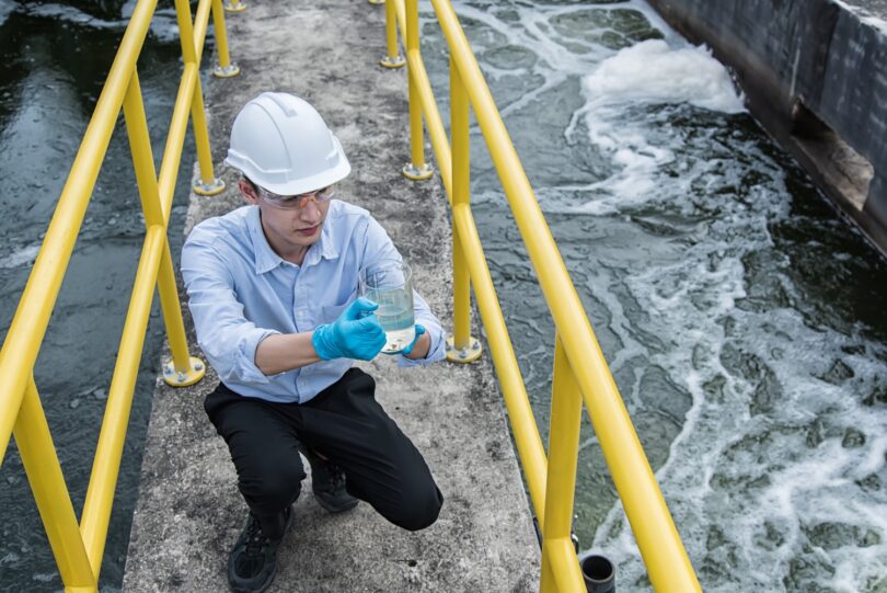 Engineer monitoring water quality at a treatment facility during operational checks