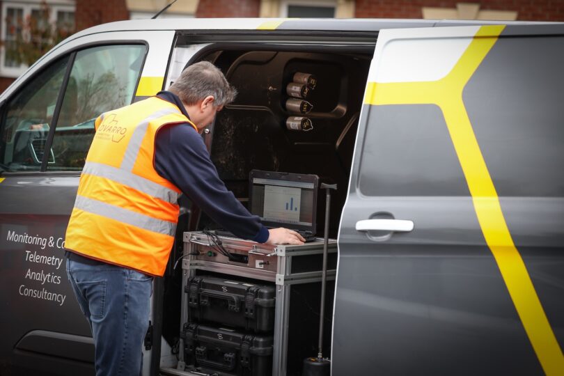 Engineer using Ovarro telemetry equipment in a service van for remote water infrastructure monitoring