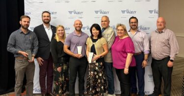 PCL Phoenix water treatment project award team group photo at Arizona Water Association event