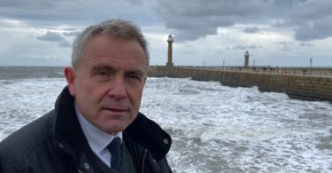 Bathing water quality partnership chair Sir Robert Goodwill pictured at the Yorkshire coast