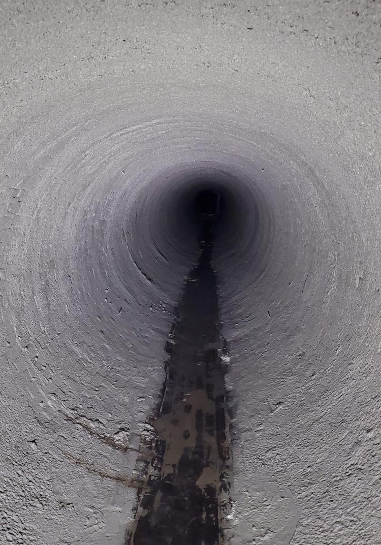 Completed geopolymer spray-applied liner inside rehabilitated 72-inch brick combined sewer in Nashville