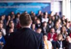 Speaker addressing water sector delegates at an industry conference
