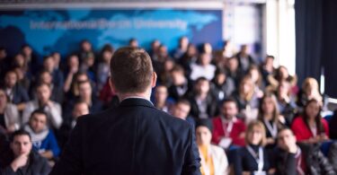 Speaker addressing water sector delegates at an industry conference