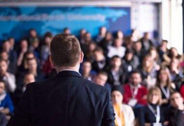 Speaker addressing water sector delegates at an industry conference