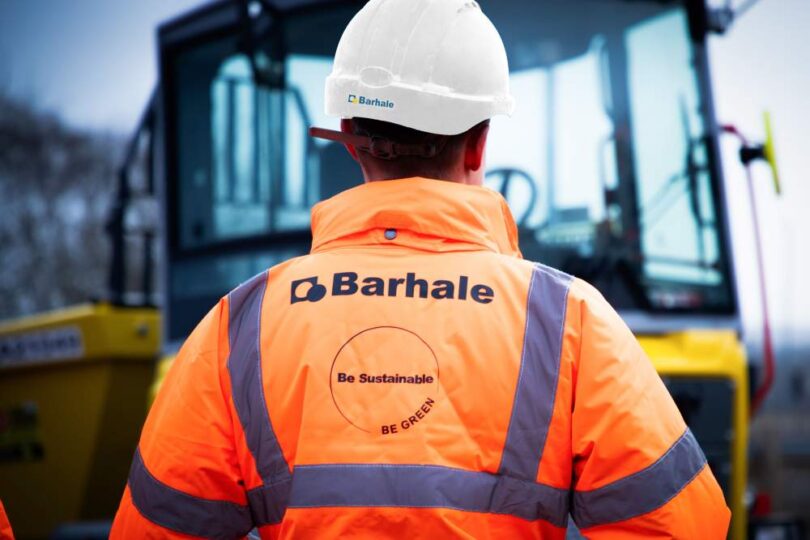 Barhale construction worker wearing high-visibility PPE at a water infrastructure project site.
