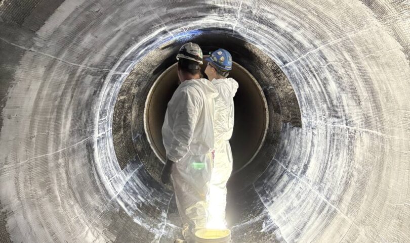 Technicians installing carbon fibre reinforced polymer liner inside Montréal water transmission main rehabilitation project