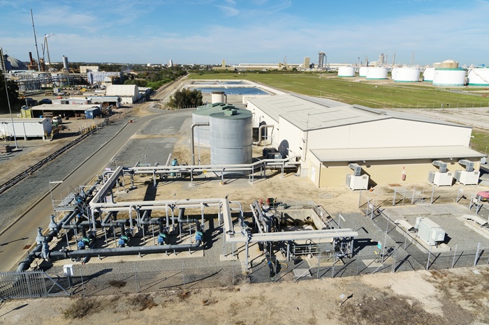 Aerial view of the Kwinana Water Reclamation Plant in Western Australia, showing treatment tanks and pipework within the Kwinana industrial area