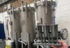 Containerised water filtration skid and scale model displayed by Amazon Filters for rapid drinking water treatment applications