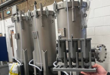 Containerised water filtration skid and scale model displayed by Amazon Filters for rapid drinking water treatment applications