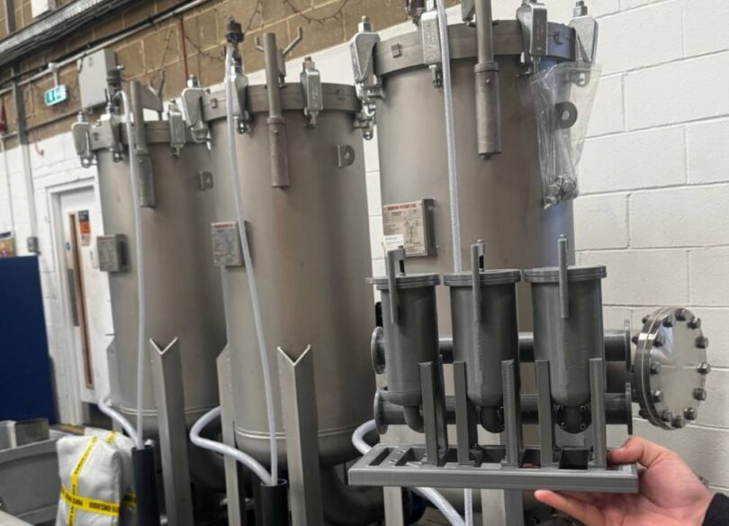 Containerised water filtration skid and scale model displayed by Amazon Filters for rapid drinking water treatment applications