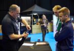 Angus Fosten demonstrating water monitoring equipment to delegates at a water sector event