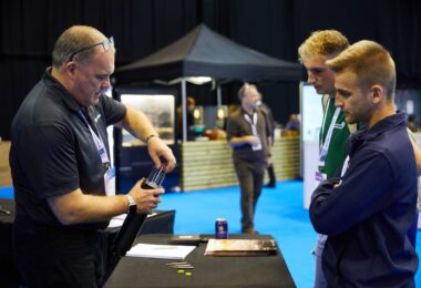 Angus Fosten demonstrating water monitoring equipment to delegates at a water sector event