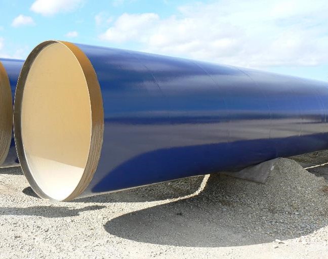 Coated large-diameter pipe sections prepared for water infrastructure use