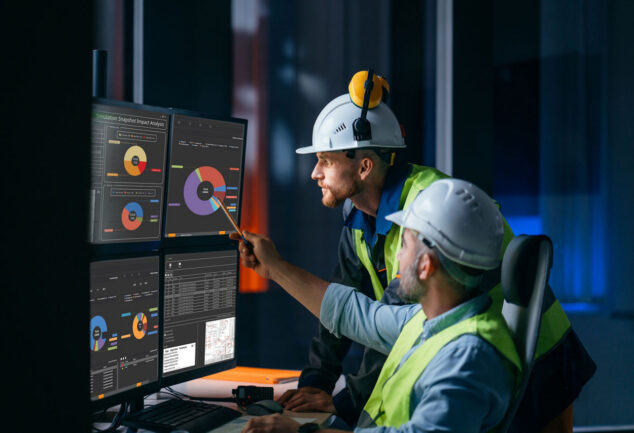 Engineers reviewing Ovation Curation Tool dashboards for power and water control systems