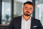 AquaStore founder Aydin Malikov seated in a business setting
