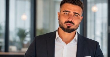 AquaStore founder Aydin Malikov seated in a business setting