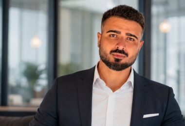 AquaStore founder Aydin Malikov seated in a business setting