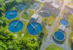 Aerial view of wastewater treatment works with circular settlement tanks