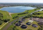 Aerial view of Esher Sewage Treatment Works and reservoir in the Thames Water region